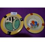 Two Clarice Cliff ash trays.