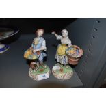 Two Dresden styled figure bases of flower sellers both hand decorated