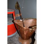 An antique copper coal bucket and sword style poker