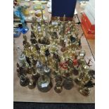 A large collection of predominantly brass vintage and retro bells.