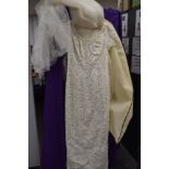 A size 14 wedding dress with extensive bead work.