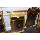 A column framed gilt mirror and oak framed with scroll work and carved phoenix decoration