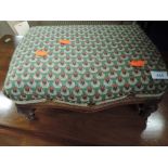 A Victorian footstool with later woolwork pad