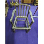 A traditional stained frame carver chair in need of recaning