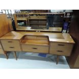 A vintage teak effect dressing table, similar to G plan, matches lots 696, 698 and 699