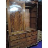 An early 20th Century Regency revival mahogany linen press having two over two drawer base