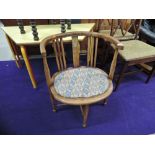 A late Victorian or Edwardian stained frame salon armchair, with repairs