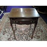 An early 20th Century mahogany side table with fitted compartmental frieze drawer, cross stretcher