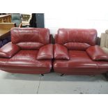 A pair of vintage style red leather armchairs and matching footstool, on chrome legs