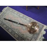 A wooden and copper bodied bed warming pan