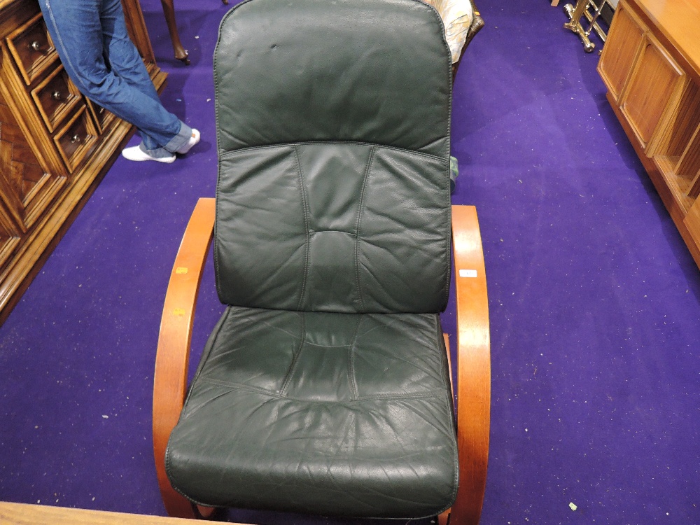 A modern ply frame armchair, in green leather