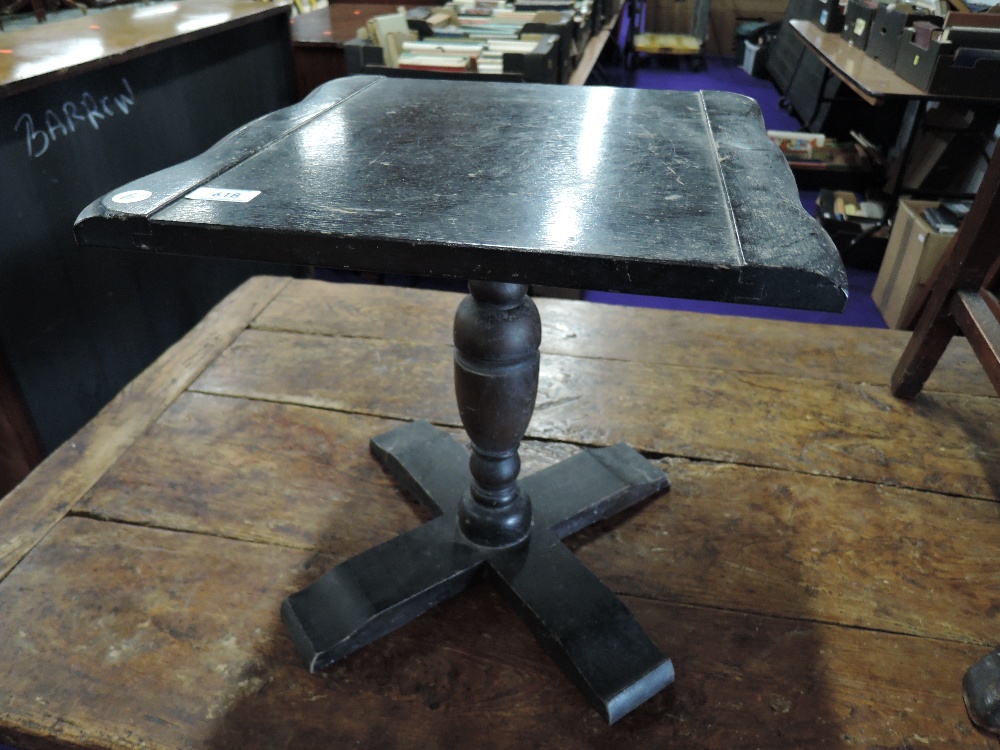 A small oak occasional pedestal table