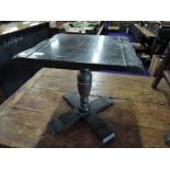 A small oak occasional pedestal table