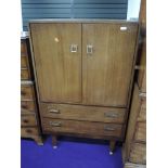 A vintage sapele 'tallboy' with double cupoboard over two drawer base, width approx. 76cm, height