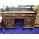 A part 18th Century composite dressing table/sideboard, panelled sides and Victorian gothic ledge