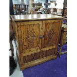 A modern oak TV cabinet, width approx. 94cm, open back and flap base