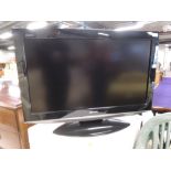 A Sharp Aquos 32' LCD TV, model number LC-32AD5E-BK