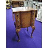 A reproduction walnut bedside chest on chest of three drawers, approx height 69cm