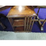 A reproduction mahogany revolving bookcase in the Edwardian style