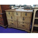 An early 20th Century mahogany chest of three over two over two cellarette style drawers