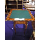 An early 20th Century continental style inlaid fold over card table, with ormolu effect detailing,