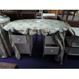 A pair of vintage kidney shaped dressing tables, with glass tops and curtain style decoration