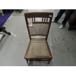 A Victorian bedroom chair having cane seat and back