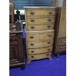 A reproduction walnut dwarf chest on chest of three over four drawers, approx height 110cm x 54cm