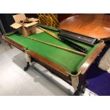 A vintage miniature snooker table 130 x 72cm, labelled Harold Holt, Blackpool, with accessories (