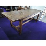 A rustic stained kitchen table, of primitive design, approx. 210 x 77cm
