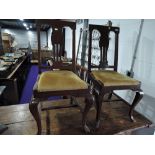 Two early 20th dining chairs having upholstered seats