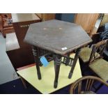 An Antique stained frame hexagonal occasional table on bobbin frame