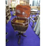 A 19th Century walnut sewing table on turned pedestal base with triple splay legs with brass inlay