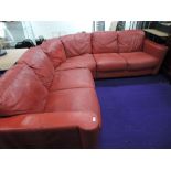 A vintage style red leather corner settee, approx. 230 x 230cm (has fire regs label)