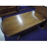 An Ercol mid stained drop leaf coffee table, width approx. 121cm