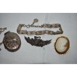 A small selection of HM silver and white metal jewellery including a locket, cameo brooch, filligree