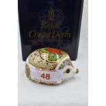 A Royal Crown Derby Collectors Guild Strawberry Hedgehog paperweight, boxed with gold stopper