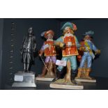 A set of three muketeer figures and similar pewter Bed Fanklin