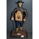 A reproduction German or Dutch figural clock of a Watch Seller AF