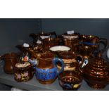 A selection of lustre ware ceramics including teapot and creamers