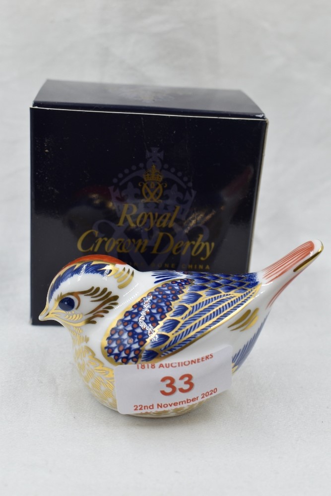 A Royal Crown Derby Goldcrest paperweght, boxed with gold stopper