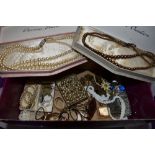 A small selection of costume jewellery including cased simulated pearls, glass pendants, Indian coin