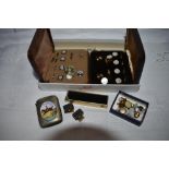 Two cased part sets of gent's collar studs and buttons, base metal vesta with hunting scene, Colibr