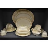 A collection of Crescent ivory, includes platters,tureen,plates,gravy boat and cups and saucers,