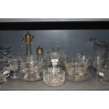A selection of clear cut and crystal glass wares including antique claret jug and sugar castor