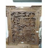 A hand carved ethnic wood Indian panel depicting Hanuman