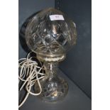 A glass table lamp in form of an oil lamp.