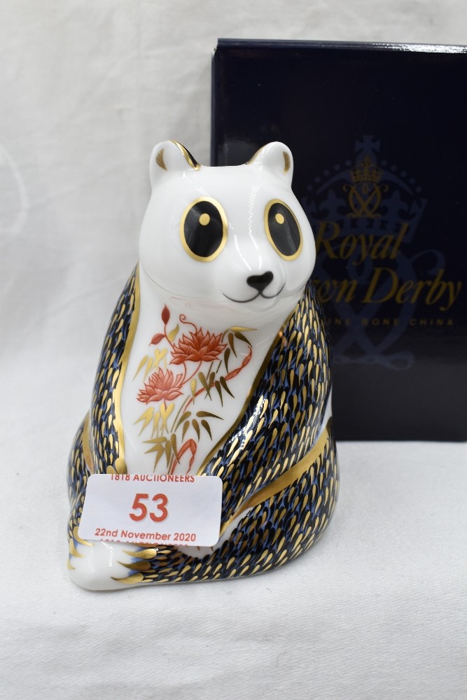 A Royal Crown Derby Panda paperweight, boxed with gold stopper