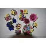 A small selection of ceramic and resin floral brooches