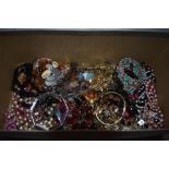 A selection of costume jewellery including strings of beads, bracelets, etc